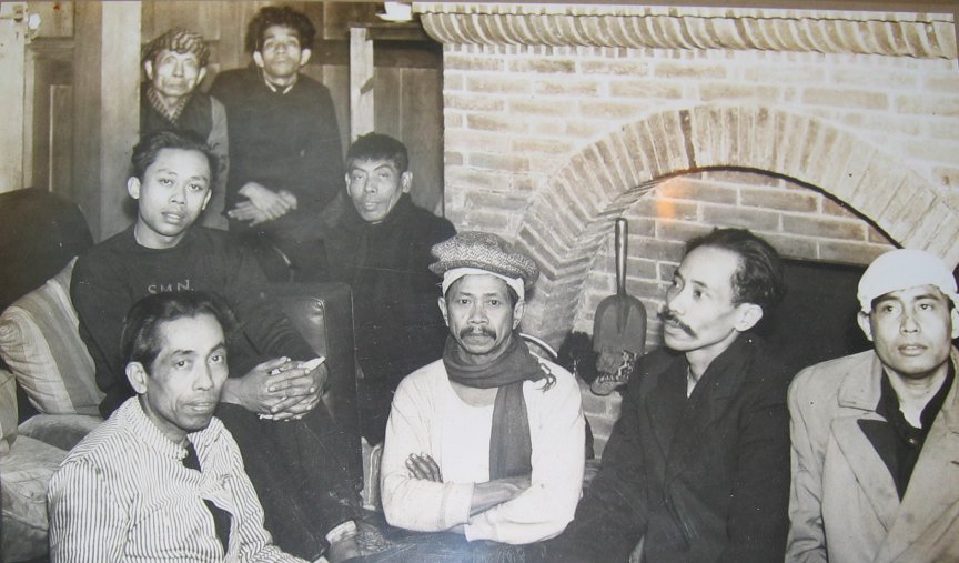 This is a photograph of some of the survivors of the Tajandoen in the lounge at the Cottage Hotel.